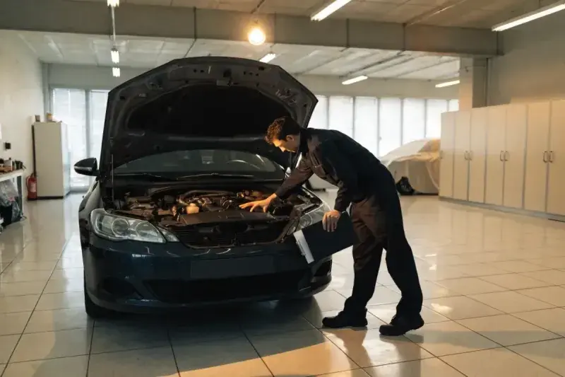 Car maintenance schedule: a mechanic performing a multi point inspection in a Mississauga workshop