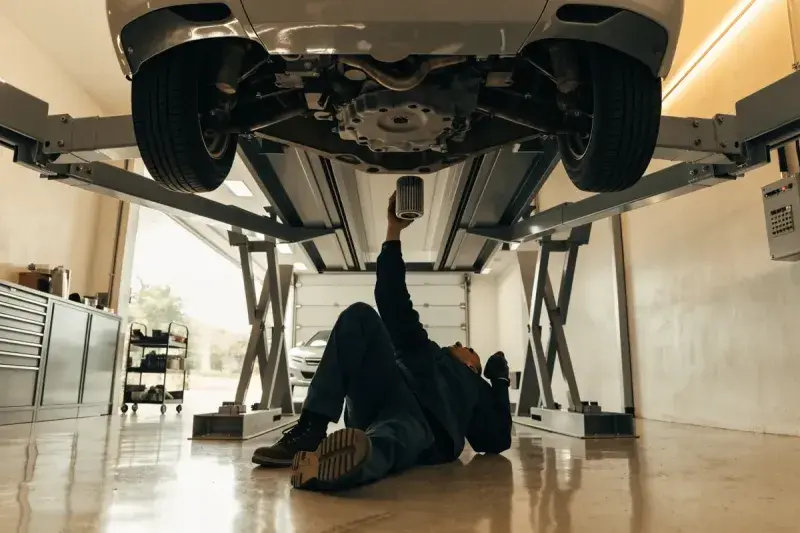 How often to change your oil: a mechanic performing an oil change in a Mississauga workshop